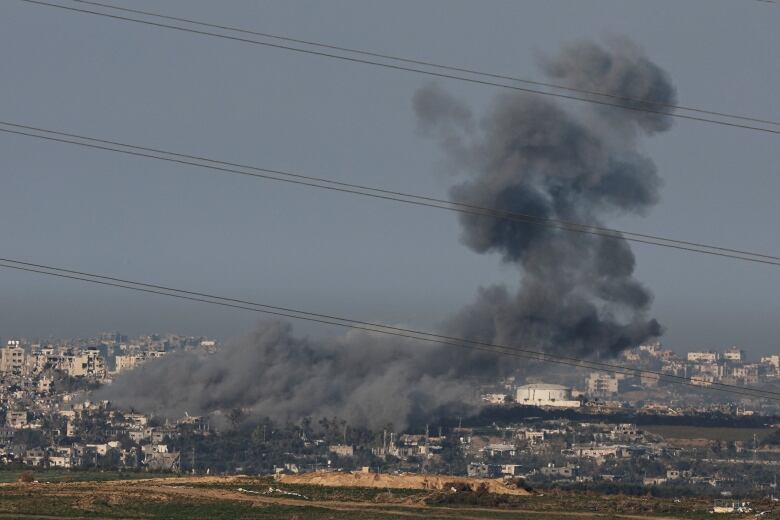 Smoke rises above Gaza, amid the ongoing conflict between Israel and the Palestinian Islamist group Hamas, as seen from Israel, January 16, 2024. 