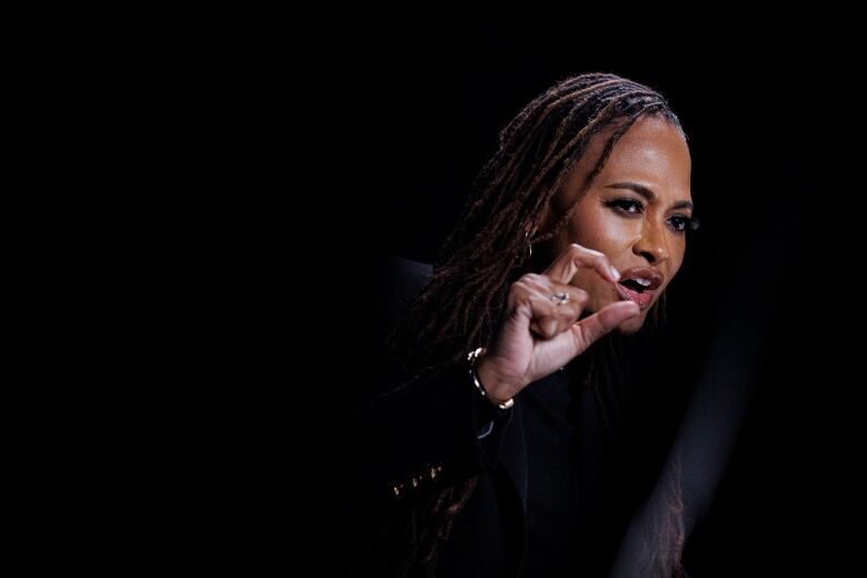 Filmmaker Ava DuVernay gestures with one hand