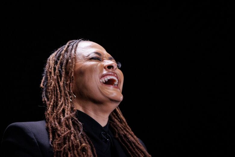 Close-up on Ava DuVernay laughing