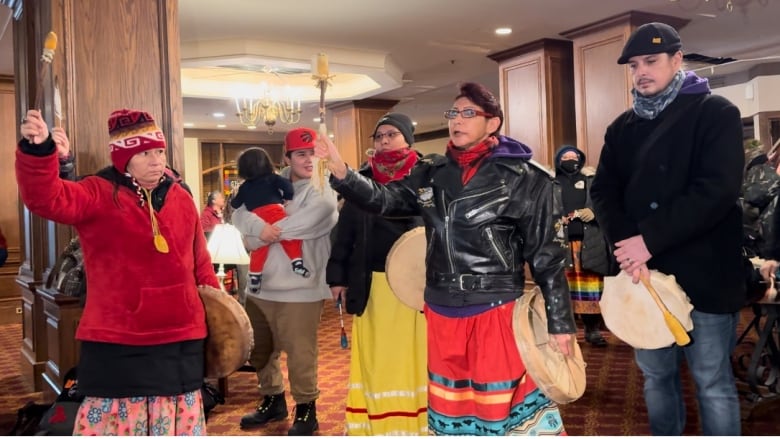 Drummers speak in their colourful attire.