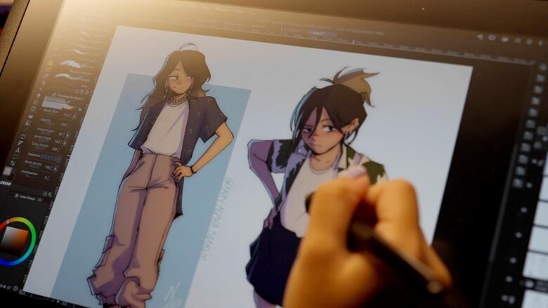 Right hand with computer stylus works on computer screen with two animated characters in progress. 