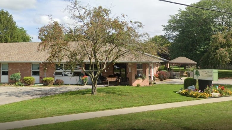 A home is shown on a sunny day.