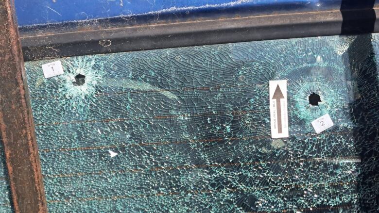 The back window of the truck driven by Tawfic Abdel Jabbar,  show two of the nine bullet holes that pierced the vehicle,  killing the 17 year old.