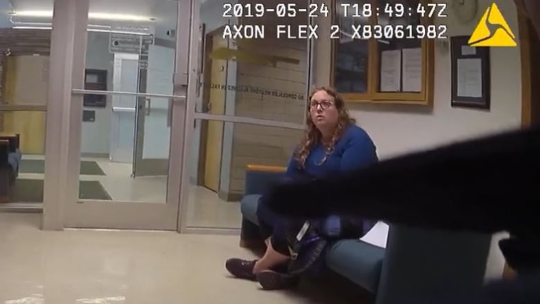 Darian Bloodworth sits in a police station as seen in body com footage from Colorado police