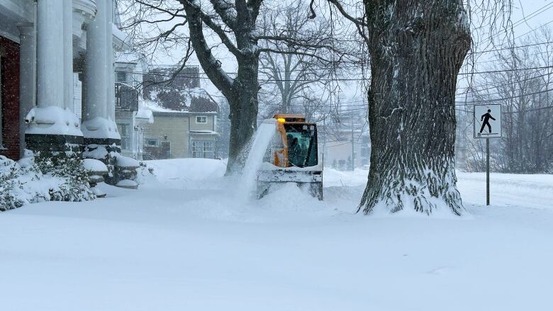 Plow clearing sidewalks