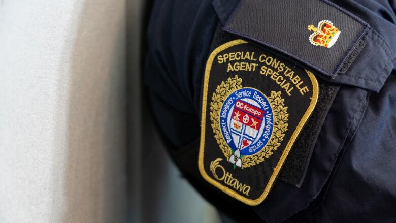 A badge on the side of a uniform that says Special Constable Officer