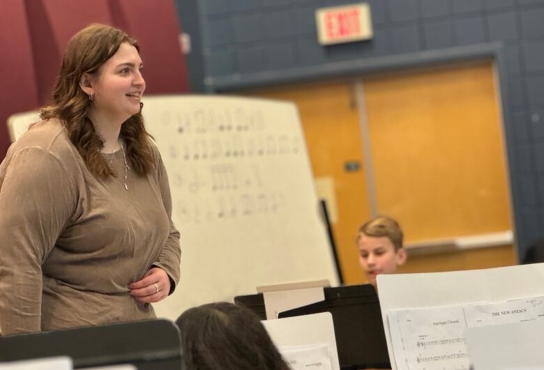 Music Education student Kiera Ghiglione leads the University of Regina Junior Wind Ensemble. 