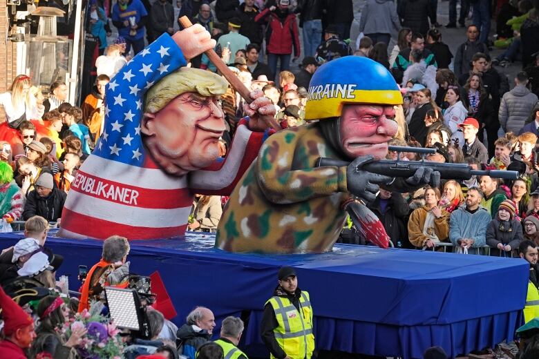 A parade float depicts Donald Trump and a Ukrainian soldier.