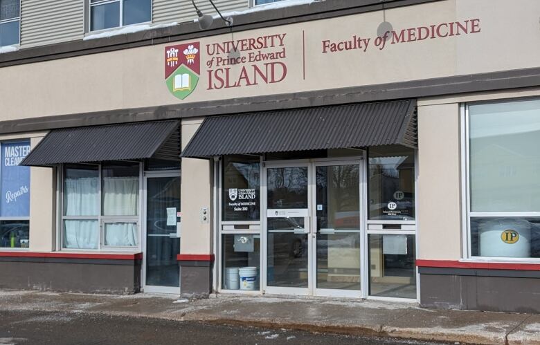 A beige building with a University of Prince Edward Island Faculty of Medicine sign above the entryway.