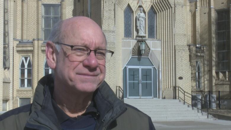 Frank Perissinotti satnds in front of St. Peter's Maronite Church