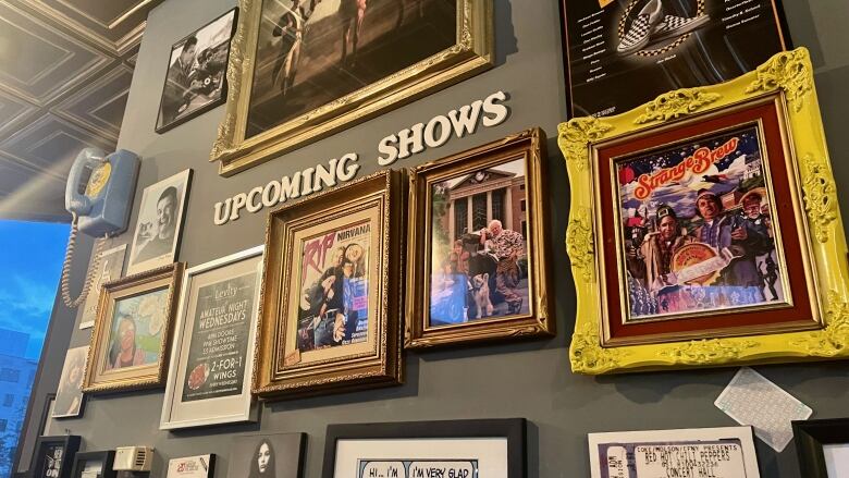 Comedy memorabilia on display on a wall. 