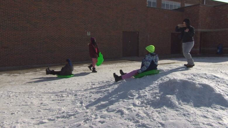 students on a hill.