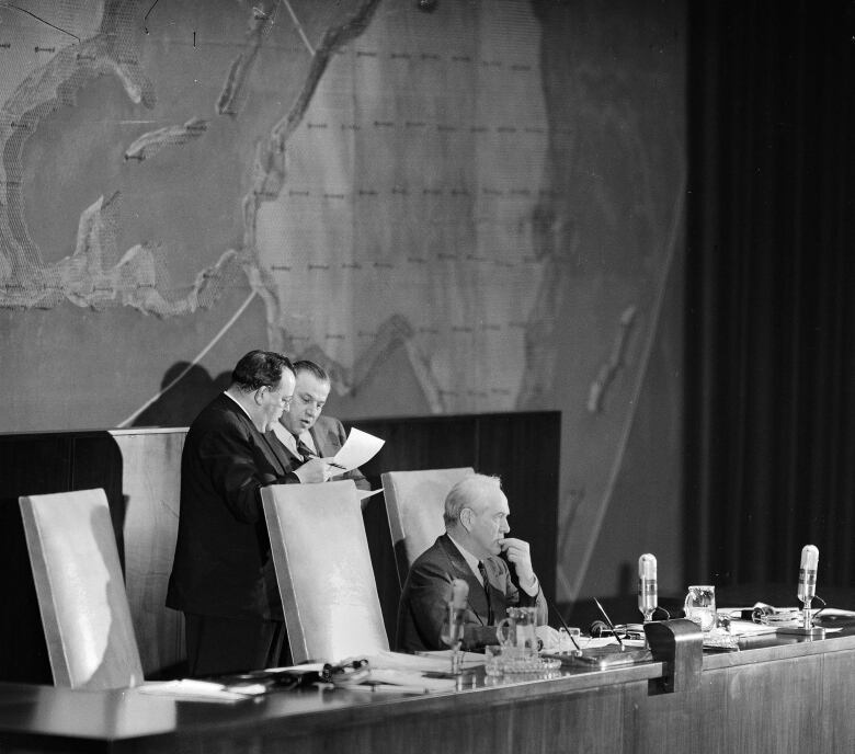 UN Secretary-General Trygve Lie, left, and Andrew A. Cordier, his executive assistant, check their lists following the vote on the Palestinian partition question by the United Nations General Assembly delegates meeting at the Queens Museum in New York,  Nov. 29, 1947.