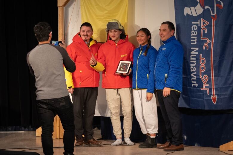 Athletes pose with the Premier of Nunavut. 