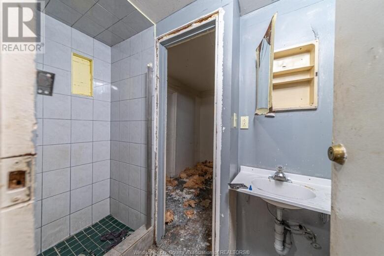 A bathroom in dire need of repair and renovation.