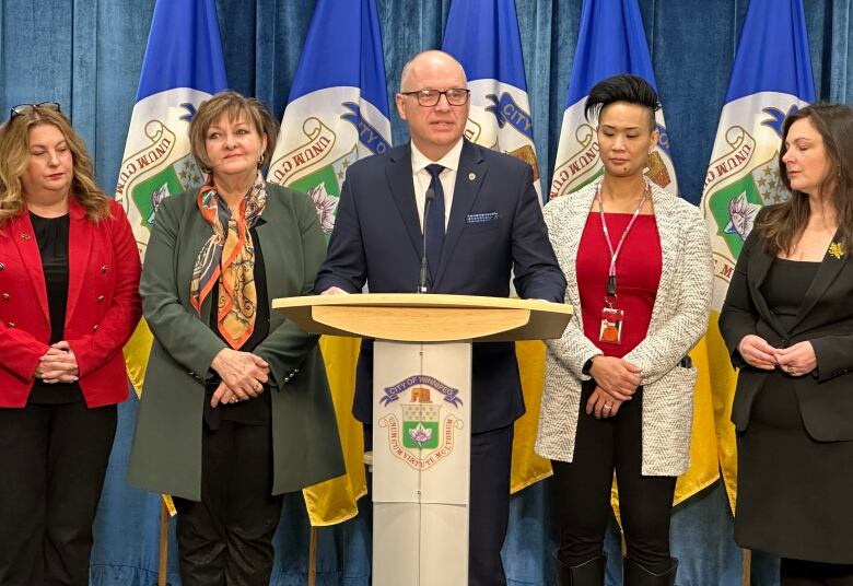 People standing at a podium.