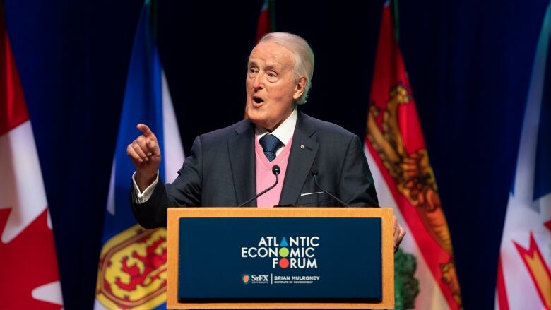 Brian Mulroney speaks from behind a podium at the Atlantic Economic Forum in Antigonish, N.S.