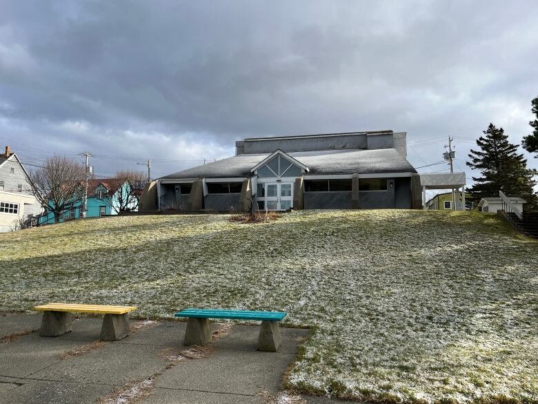 A building sits on a hill.