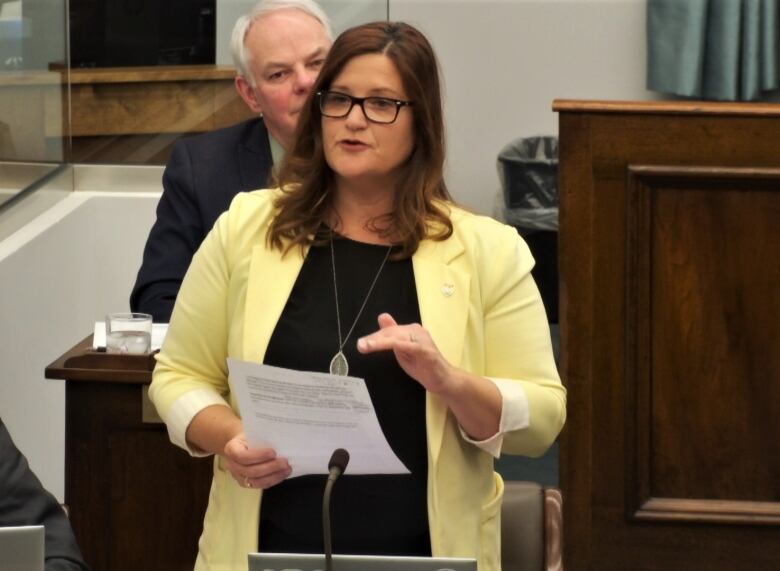 Karla Bernard standing at her desk in the P.E.I. Legislature.