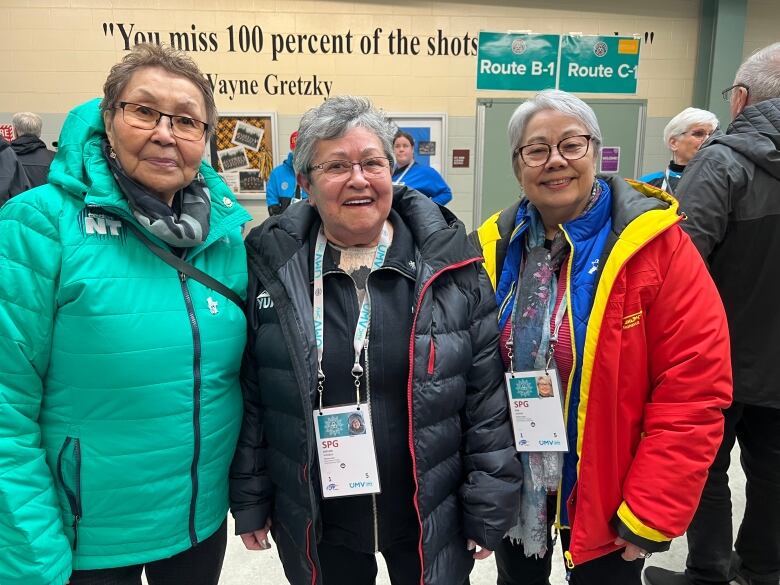 Three older women pose for a picture