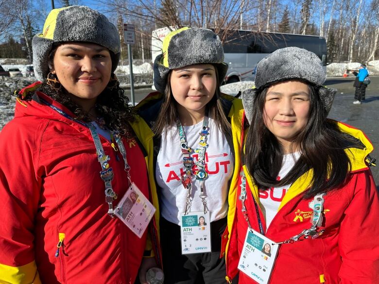 Three girls smile