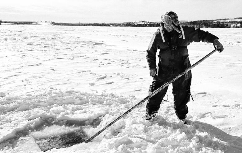 man fishing on ice