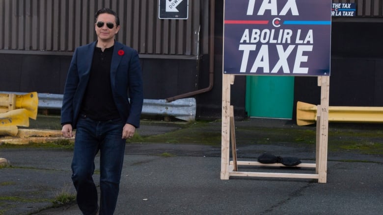 Conservative Leader Pierre Poilievre holds a press conference on his Axe the Tax message from the roof a parking garage in downtown St. Johns on Friday, Oct. 27, 2023.