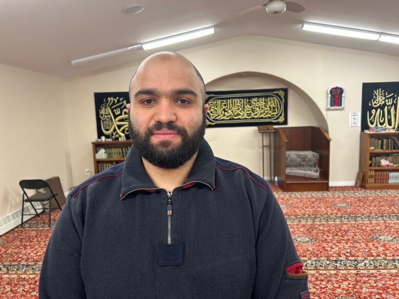 Man stands inside mosque