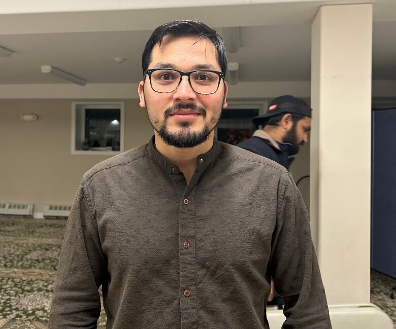 Man stands in basement of mosque