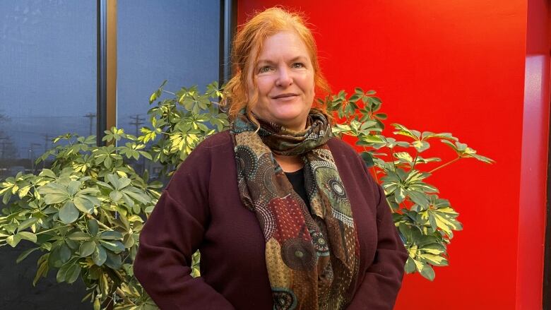 Roxanne Carter-Thompson standing inside a lobby.