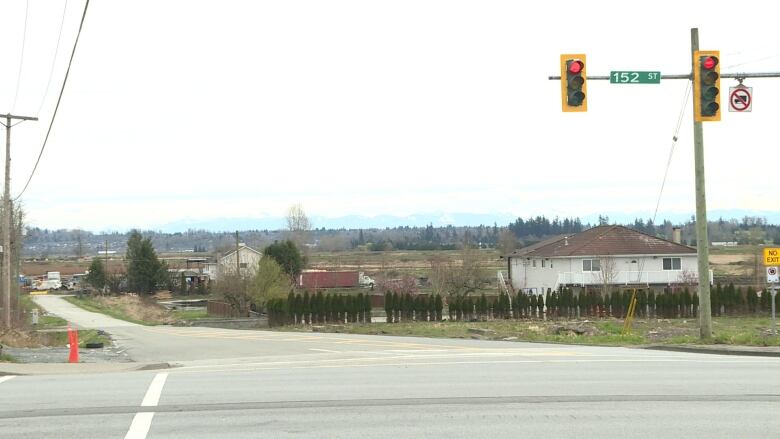 A large road that trails off into farmland.