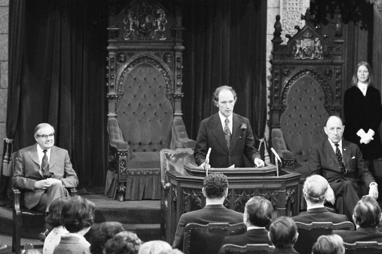 Prime Minister Pierre Trudeau addresses the Senate Chamber in June, 1974. To his left is NATO Secretary General Joseph Luns.