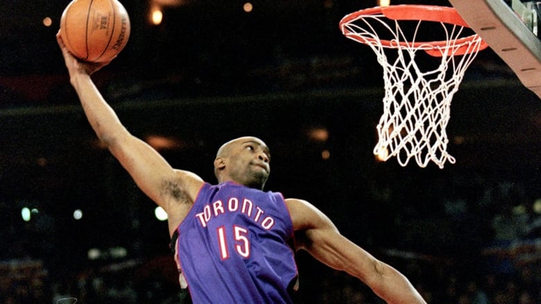 Toronto Raptors guard, with city name and number on his jersey, jumps to make the slam dunk during the NBA all-star game slam dunk contest on Feb. 13, 2000 at the Oakland Coliseum in California.