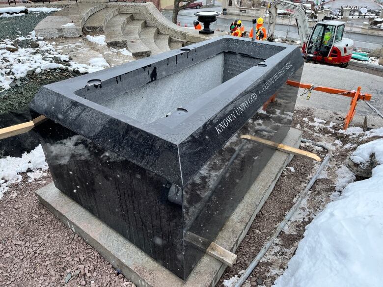 a black granite vault at the base of the Newfoundland National War Memorial.