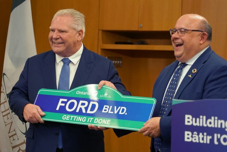 smiling ford with kitchener sign 