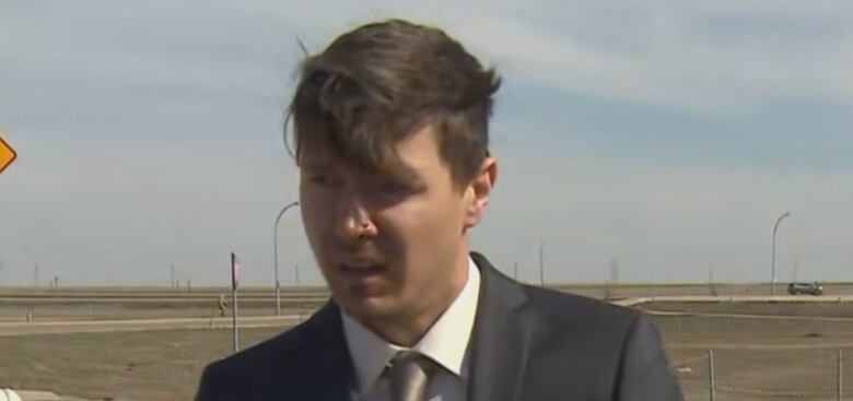 A person talks during a news conference