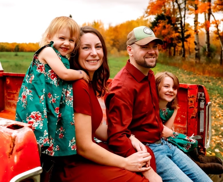 Robert Kirschman is training for a triathlon to raise awareness and money for his rare form of cancer, but also to serve as an inspiration to his daughters. Ella, left, and Aubrey, are pictured with Kirschman and his wife, Chelsea.