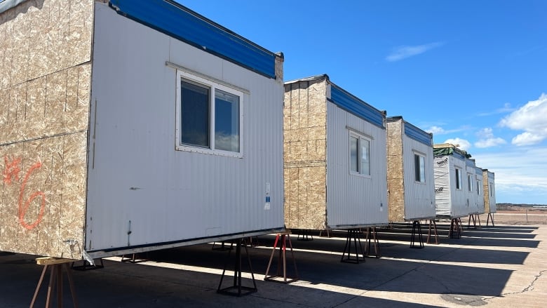 Modular building units are standing on pylons as they wait to be converted into a shelter complex in Summerside