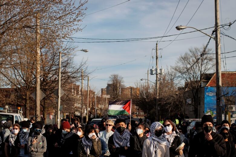 Protesters block a rail line in Toronto during a rally organized by World Beyond War on April 16, 2024.