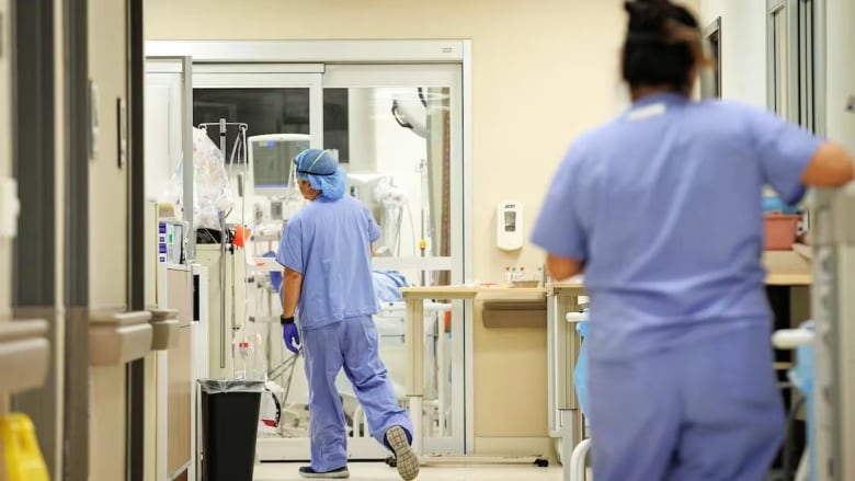 health-care workers walking around hospital