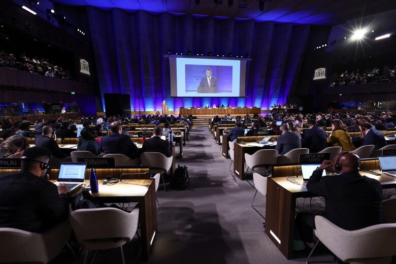 Negotiators sit in the opening plenary for the second of five negotiating sessions on a global plastics treaty, hosted in Paris in May 2023.