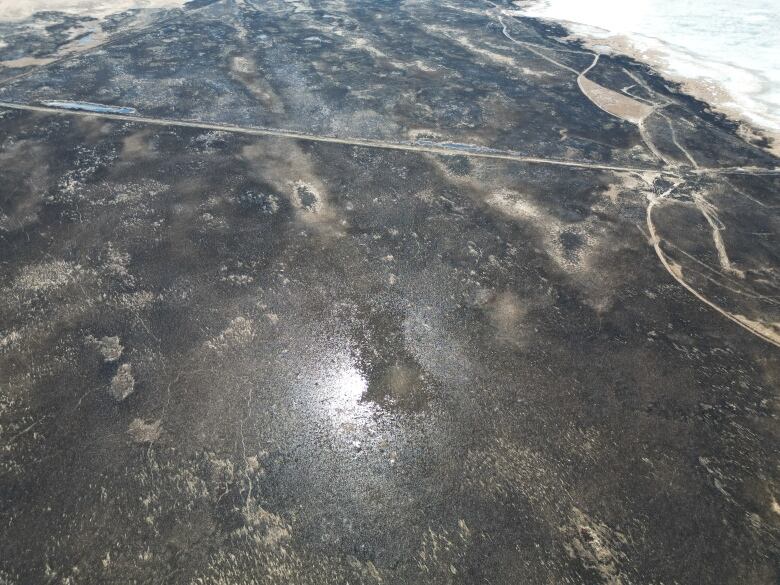 An aerial shot over the Twin Lakes Beach area of St. Laurent shows a huge area of burnt vegetation with few roads to stop the flames from spreading.