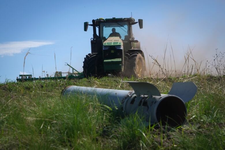 Russian missile fragment seen near area where a farmer works in his field in Izium, Ukraine.