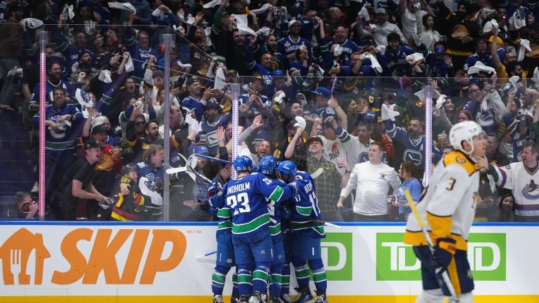 Hockey players celebrate.