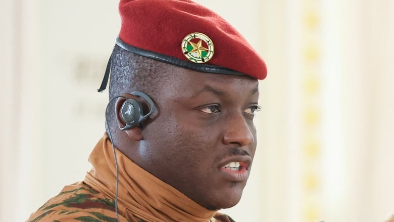 Close up of a man in a red beret