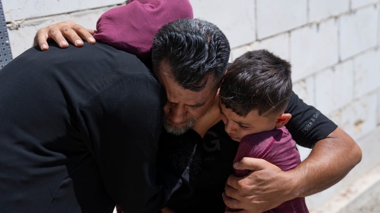 Mourners cry after taking the last look at the body of Qusai Matan, 19, during his funeral in the West Bank village of Burqa, east of Ramallah, Saturday, Aug. 5, 2023. On Friday the Palestinian Health Ministry said that armed Israeli settlers had entered the West Bank village of Burqa and shot and killed 19-year-old Qusai Matan. The Israeli military said it had received reports that Matan died as a result of settlers shooting toward Palestinians in the village and said it's investigating.