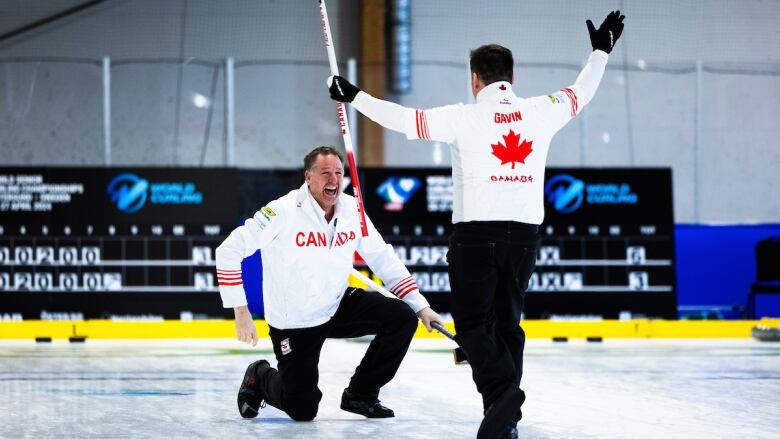 Curlers celebrate on the ice