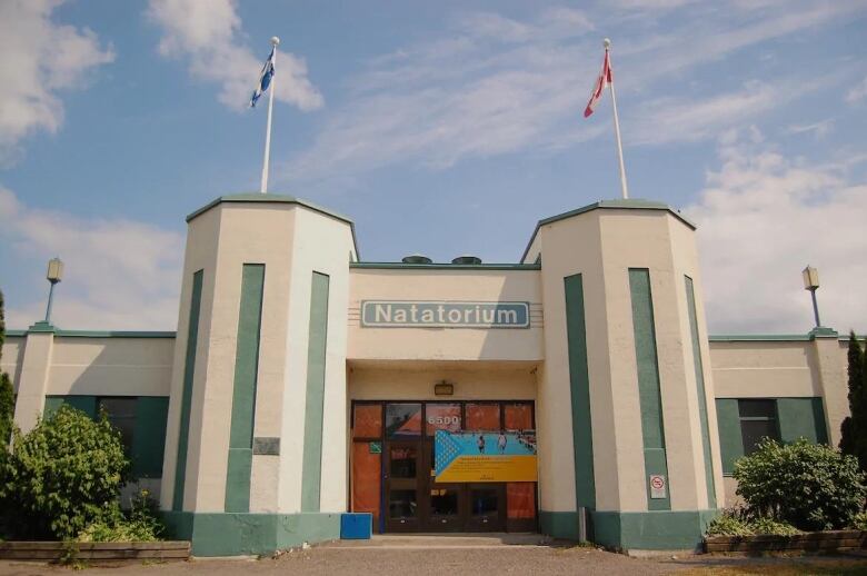 A white and teal building.