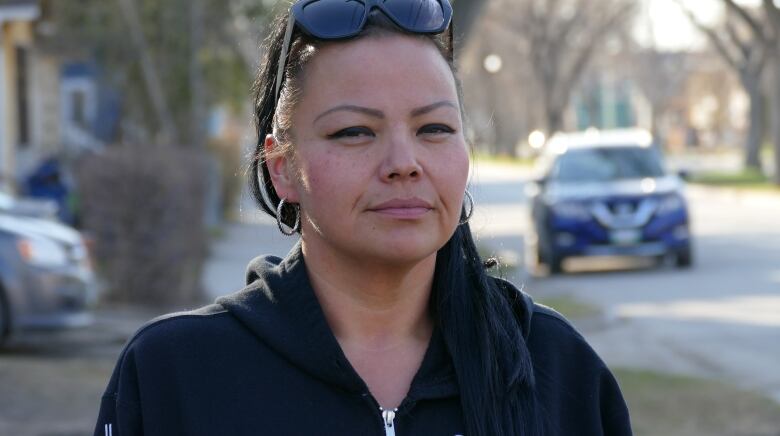 A woman smiles to the camera.