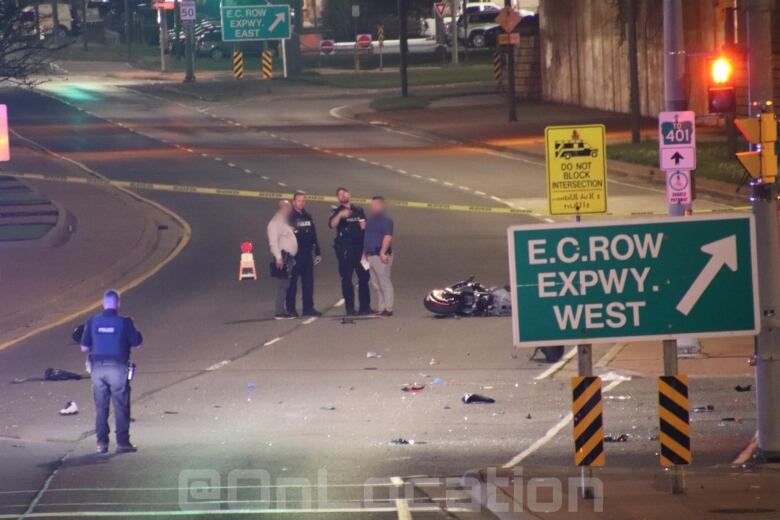 A motorcycle crash scene at night.